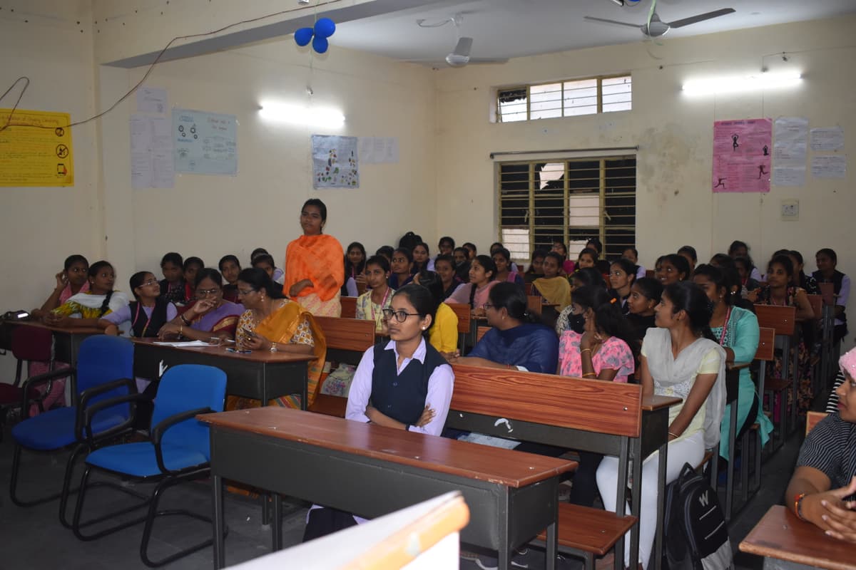 Young women attending a college classroom session